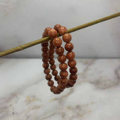 kogelarmband 8mm rode goudsteen 