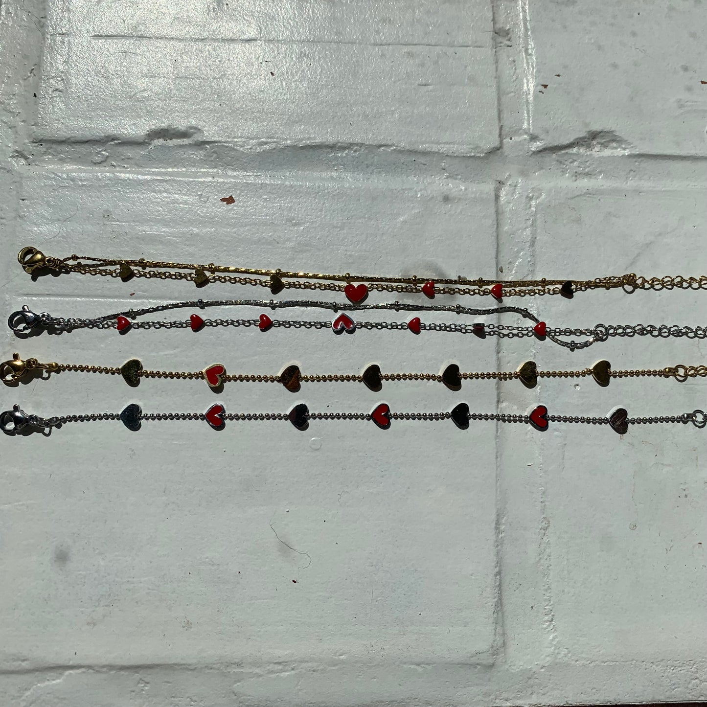 al mijn armbandjes op een rij zilver en goud 